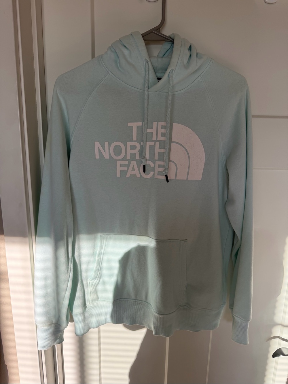 The North Face women’s  Hooded Sweatshirt in Light Aqua